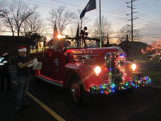 Santa’s antique fire truck is aglow for its evening runs through Vienna.