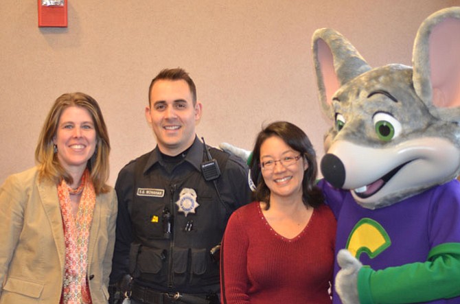 Town of Herndon Vice Mayor Jennifer K. Baker with Herndon Police Officer Monahan, Herndon town council member Grace H. Wolf and Chuck E. Cheese at the December Cops & Kids event, hosted at Herndon Police Department in Herndon, VA.