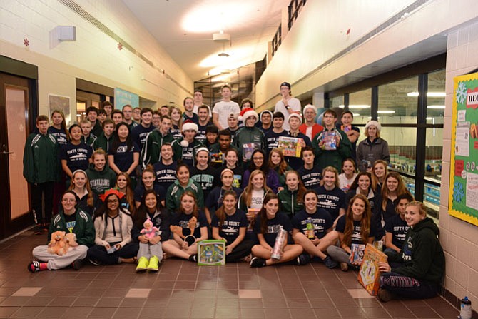 Members of the South County High School Swim and Dive Team donated toys at South Run RECenter.