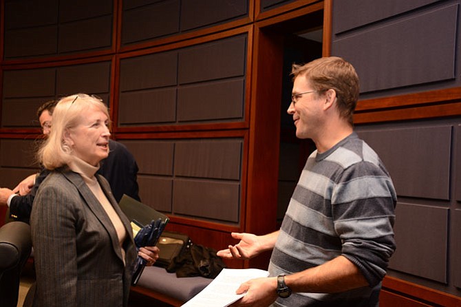 Delegate Vivian Watts (D-39) (left) speaks with Jonathan Damm of Reston (right) following the Fairfax delegation public forum.