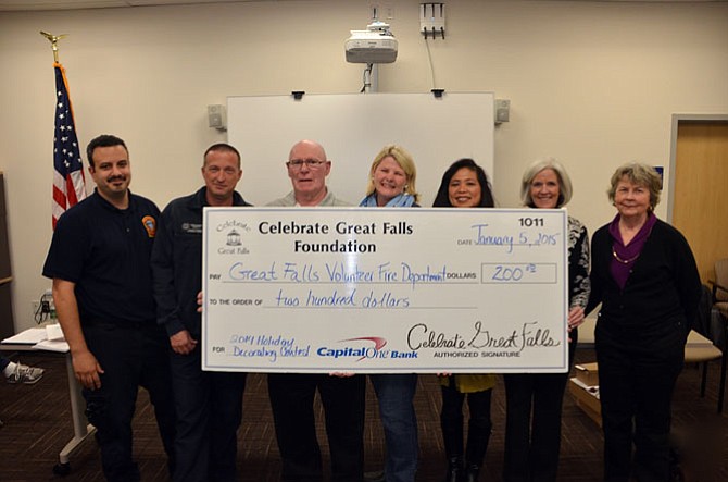 Fire Chief Doug Wessel, Career Medic, Jason Buttenshaw, Past Chief Homer Johns, Erin Lobato , Malou Rennert, Glynis Canto and Fire Department Joan Bliss. Not in picture: Karl Sallberg.
