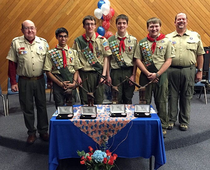 Powhatan District Eagle Advisor Stephen Housley (left) joins Troop 1313 Scoutmaster Vernon Joyner (right) to congratulate Eagle Scouts (from left) Vijay Iyer, Charlie Quinn, Tom Joyner, and Jonathan Lee. 
