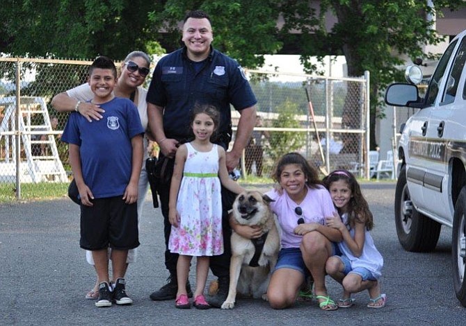 Gracie, Alexandria’s first female police K-9, is shown with APD officer Steven Escobar and his family. Gracie died Dec. 24, 2014 from complications from kidney cancer.
