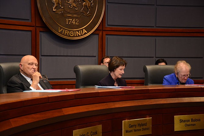 Fairfax County Board of Supervisors chairman Sharon Bulova (center) reads her statement calling for outside input on improving information disclosure policies.
