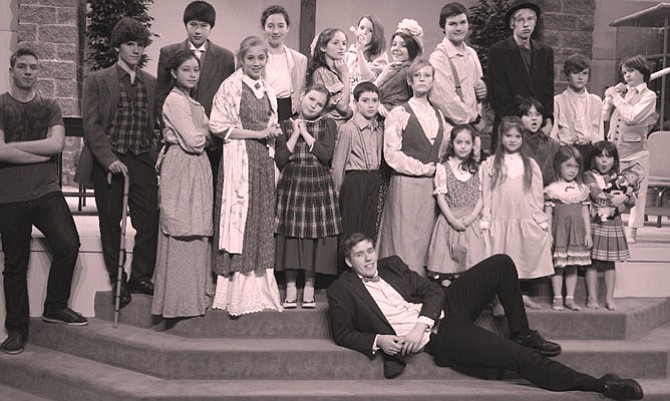 Posing in character are members of the Black, Briggs, James, Lorence, Ludwinski, Mika, Mills, Okada, Schaaf, and Thorson families who make up the cast of Sovereign Grace Co-op's 2015 production of “Our Town.”
