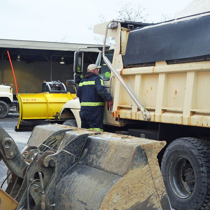 It is 7 a.m., Wednesday, Jan. 14 and Mike Haynes is checking in with a City of Alexandria truck driver after dumping in 2 tons of salt from his loader.  The trucks had been out working since 1 a.m. preparing for predicted snow and sleet.
