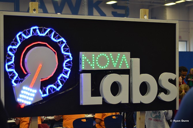 A sign displaying the logo of Nova Labs at the first inaugural NoVA Mini Maker Faire at Reston South Lakes High School. Last year was the first NoVa Mini Maker Faire, which sold over 3,000 tickets, and helped guide visitors to displays related to technology and engineering. 