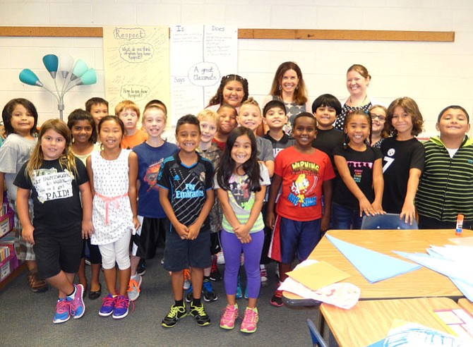 Brookfield Elementary counselor Kathleen Otal (back row, center) with students in teacher Tracy Foster’s third-grade class.
