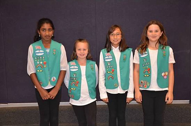 From left -- Ruhi Jame, Gracie Larrick, Melissa Herr and Taylor Anderson, all students from Fox Mill Elementary School, pictured in their Junior Girl Scout Vests, in September 2014 when they received the medals. The girls are from Service Unit 51-7.
