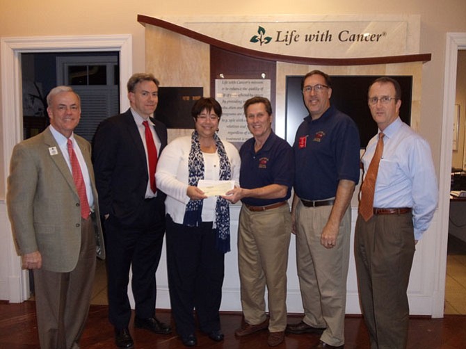 Members of the Clifton Lions Club present a check to Life With Cancer (LWC) at the LWC facility by Fairfax Hospital. (From left) Jay Moughon, Clifton Lions and second vice district governor; Mike Carter, INOVA Health Foundation, director of outreach; Catherine Intartaglia, Life With Cancer, director of development; Jim Chesley, Clifton Lions and Labor Day Car Show organizer; Rich Kurz, Clifton Lions, president; Jim Boatner, Clifton Lions, past president.
