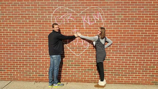 Chris Rowson proposes to Kellie McDonald on Saturday, Jan. 17 on the grounds of Fairview Elementary School in Fairfax Station, where the couple first knew each other as students.
