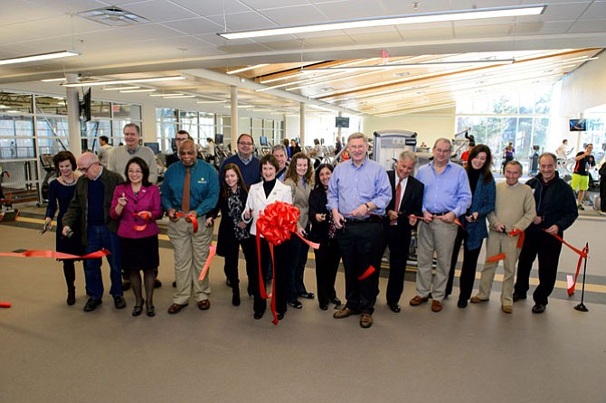 Fairfax County Board of Supervisors Chairman Sharon Bulova and Dranesville Supervisor John Foust - center - join representatives from the county Park Authority, McLean Youth Athletics and staff at Spring Hill Recreation Center’s ribbon cutting Jan. 10.
