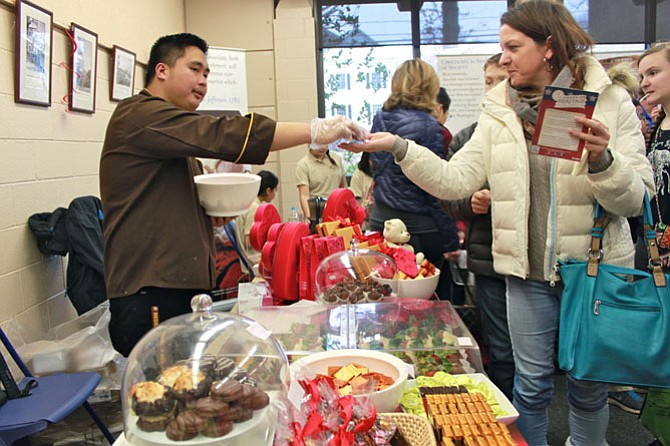 Katrin Wilke, McLean takes a sample at the McLean Chocolate Festival Jan. 25.
