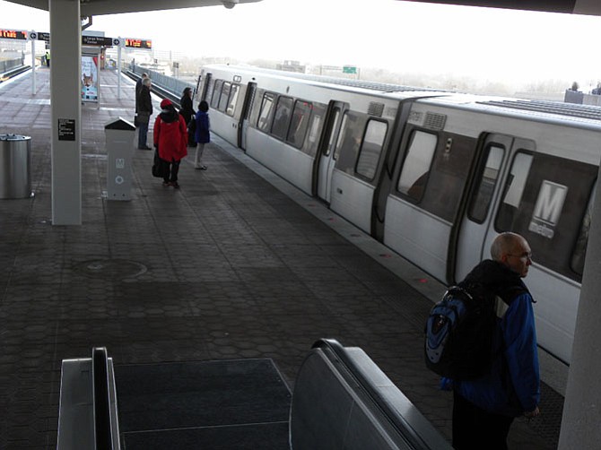 Riders at the Tysons Corner station get ready to board the Silver Line train to Largo Town Center.
