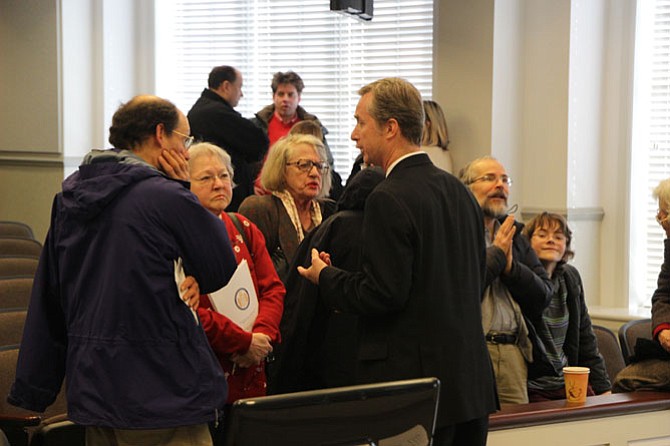 Del. David Bulova (D-37, center right) meets with constituents following the town hall meeting Jan. 31.
