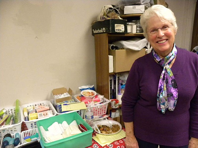 Volunteer Gail Michael minds the hygiene supplies made available to clients of Facets of Fairfax’s hypothermia program. Toothbrushes, shaving materials, and other hygiene products are available for clients to take.