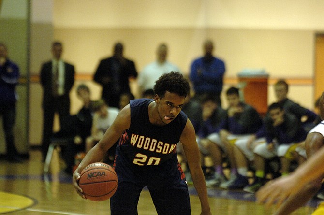 Woodson senior point guard Eric Bowles scored 18 points and grabbed 11 rebounds against Lake Braddock on Tuesday.