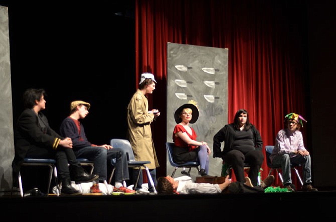 Herndon High School has long had active drama, music and arts programs. In February, students in the drama team put on two one act plays. In this scene, the Inspector (Raleigh Hampson) inquires about the murder of the mysterious host (Moritz Barth). Other cast included Allie Kassraie, Sarah Inge, Jordan Rees, Hannah Carrithers, and Justin Spiegel.