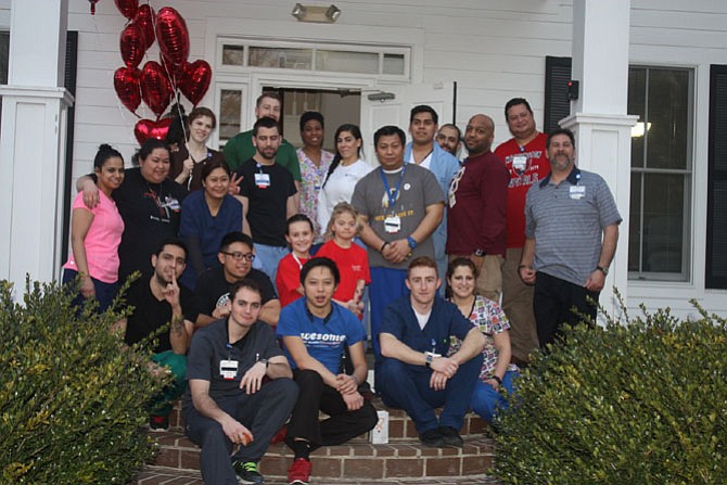 Inova staff members gather with Anna (center left) and Sadie Lauer (center right) outside The Woods community center in Burke, after completing the sixth annual Friends of Sadie Blood Drive.
