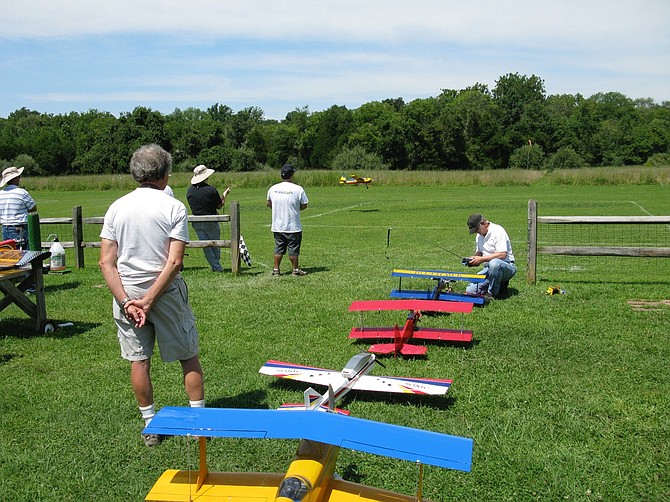 Members of the Northern Virginia Radio Control club spend time at their current field at Poplar Ford Park in Chantilly.