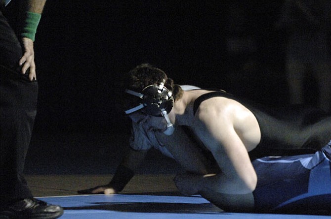 Centreville’s Tyler Love pins Yorktown’s Jason Kappel to win the 195-pound championship during the 6A North region wrestling tournament on Feb. 14 at Centreville High School.