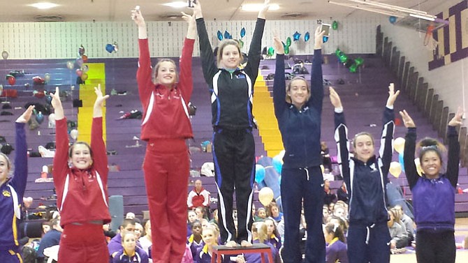 Fairfax gymnast Rachel Barborek, center, won the 6A North region floor championship on Feb. 11.