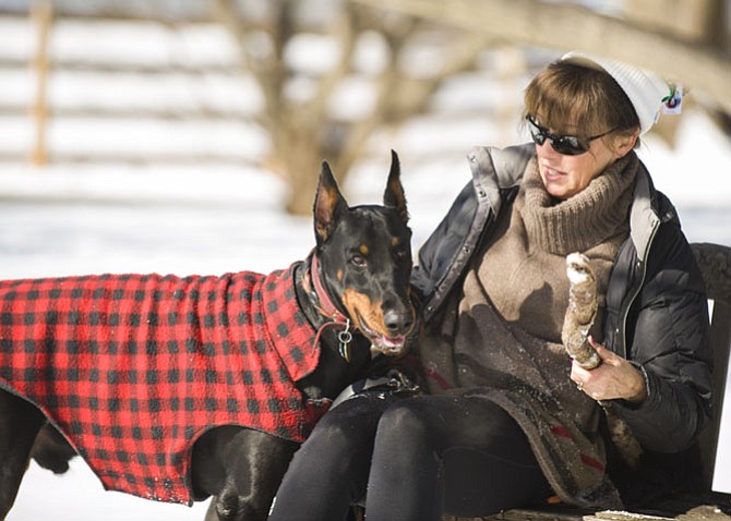 Angela Boyer and her Doberman Marz in a snow day last week in Great Falls. 