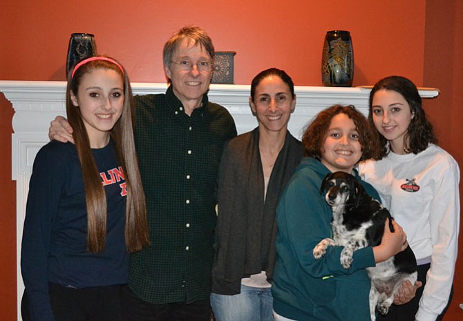 The Schneider family of McLean - Farah, Phillip, Fatima, Peter, and Sami - with their King Spaniel/Beagle mix, Tibby.
