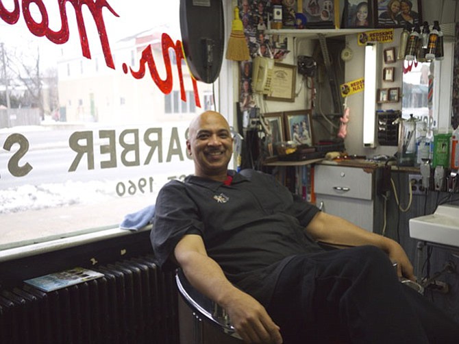 Jim Moore in his barbershop. 