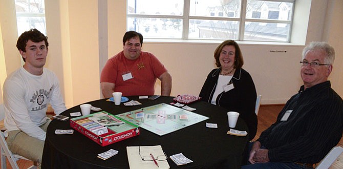 Paul Poling of Fairfax Station,  last years Monopoly Champion, getting ready to start against John Marani of Centerville, Kathryn Poling of Fairfax Station and Tom Moore of Fairfax Station.
 
