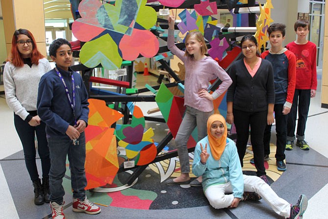 Evelyn Melendez-Quintanilla and Jiji Maghoub (left) with Maisum Qadri, Emma Wosje, Lena Smith, and Ryan Bloom (right) stand by their table designs. Jiji Maghoub’s piece sold to the public.
