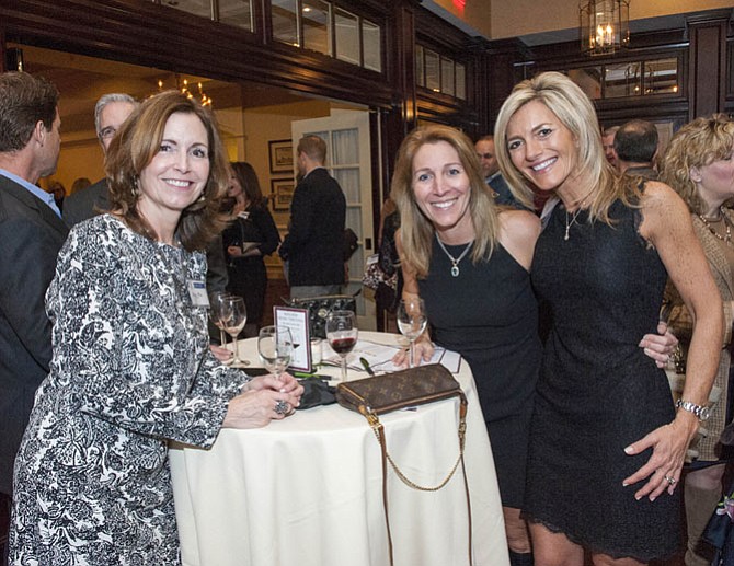 Amy Frix, Patti Hulett and Alison Duenkel at the Winter Wine Tasting at River Bend Country Club.
