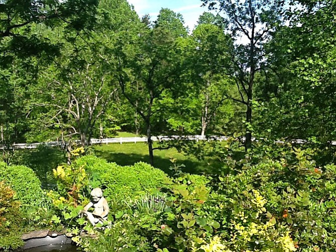 A curving driveway leads visitors through towering oaks and flowering cherry and plum trees to a Federal-style home was built in 1964 and renovated quite literally from the ground up in 2001. This property is a must-see for antiques enthusiasts and avid garden designers alike. 
