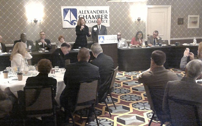 Vice mayor Allison Silberberg, standing center left, address attendees at the Chamber of Commerce Legislative Breakfast March 10 at the Hotel Monaco. Next to her is chamber government relations committee chairman Dak Hardwick.
