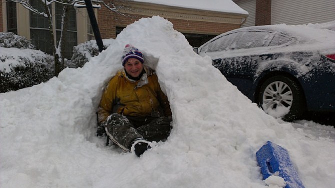 Michael Eidelkind of Fairfax Station has been working on his snow cave for an hour at this point. “Six years ago I built one big enough for two and I’ve been dreaming of it ever since,” he said.