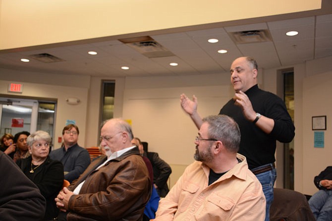 Greg Paspatis of Alexandria (standing, right) speaks at the March 9 meeting of the Virginia Citizens Coalition for Police Accountability. Seated, from left, are Anita and Salvatore Culosi, parents of Dr Salvatore “Sal” Culosi, Jr, who was killed by a Fairfax County Police officer Jan. 24, 2006 outside his Fair Oaks townhouse.
