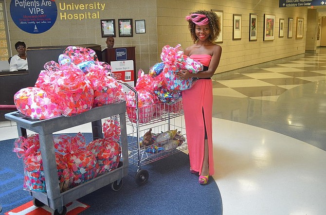 Sarah Musa of Springfield delivers baskets of supplies for new mothers at Howard University Hospital on Aug. 3, 2014.