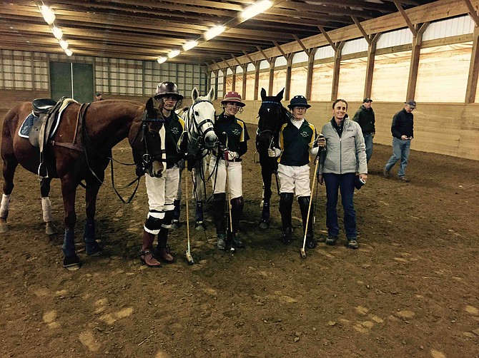 The West Shore Polo Team is one of a handful for young polo players in the Washington, D.C. area, but Patricio Fraga-Errecart and his coaches are hoping other teenagers will pick up the game. From right: Coach Cindy Halle, Patricio Fraga-Errecart, Sarath Lynch and Chase Baker, at the first middle school polo championship from the U.S. Polo Association in November 2014 at Marwan Farm Polo Club. 
