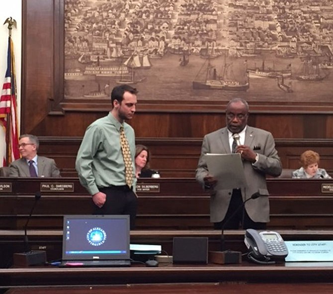 Nick Arent, state organizer for Virginia Fair Share, accepts the city’s proclamation about the efforts of Hunger-Free Alexandria from Mayor Bill Euille.