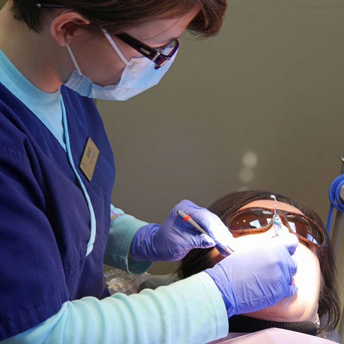 Most of the dental appointment according the dental hygienist Sidney Siewert is scaling the enamel to remove tartar from the teeth, then polishing and flossing.