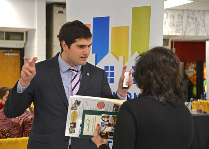 Timothy Nelson was one of the representatives at the booth for first time sponsor and exhibitor Northern Virginia Association of Realtors (NVAR). Nelson is a financial advisor and a member of the NVAR Finance Committee. Here he was enthusiastically offering information to an Expo attendee.
