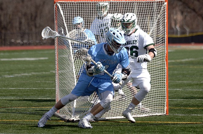 Senior attackman Charlie Tiene (4) is a captain for the Yorktown boys’ lacrosse team.