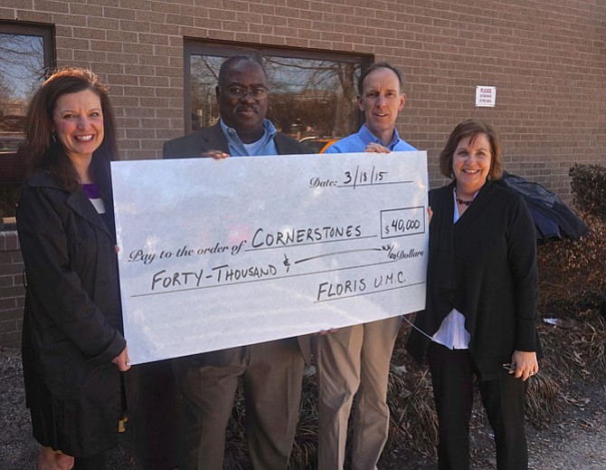 From left -- Cornerstones Chairman of the Board Jill Norcross, COO Greg White, Floris UMC Lead Pastor, Rev. Tom Berlin, and Cornerstones CEO Kerrie Wilson pose with the mock up check representing the $40,000 donation made to Cornerstones by the members of Floris United Methodist Church in Herndon. Each year, Floris donates its Christmas Eve offerings to a nonprofit partner or to a special need or cause in the community or around the globe. The Floris members have been making this donation for more than 10 years.
