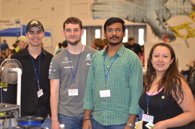 George Mason University students attended the March 15 annual Reston NoVa Mini Maker Faire and had booths at the South Lakes High School. Pictured are John Hill, Ryan Cerny, Nithin Ellanki, and Jade Garrett. Garrett is president of the GMU student operated Inventors Club.
