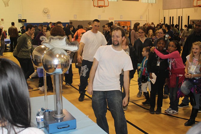 Dr. Eric Bubar, an assistant professor of physical sciences at Marymount University, wowed students with electricity demonstrations at the STEAM/Science Fair at Fort Belvoir Elementary School.   