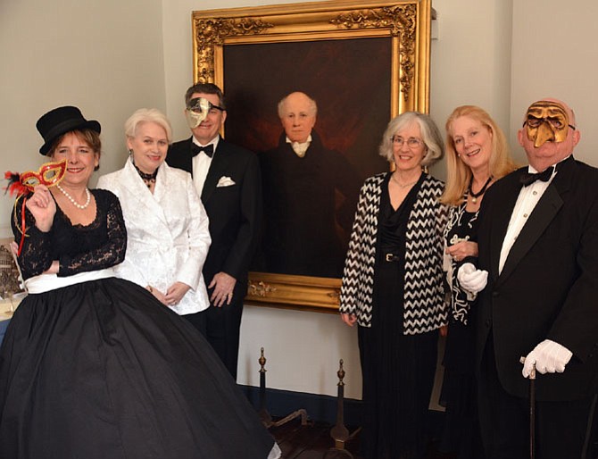 Dressed up and ready for Gadsby’s Best Bid & Tucker Ball are Karen Byers, Gadsby's Tavern Museum Society (GTMS) board of directors; Kay and Terry Zerwick, GTMS president; John Gadsby; Carol Ann Brown, GTMS secretary; Nancy Smith, GTMS membership chair; and Danny Smith, GTMS former president.
