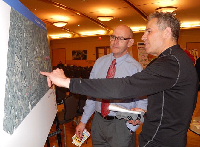 (From left) Transportation consultant Brian McMahon and resident Jeff Dove discuss the project.
