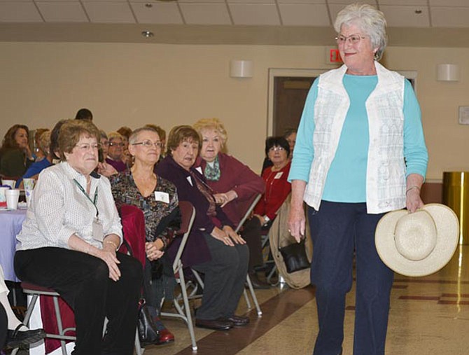 Mary Walher of Fairfax models a spring tunic and hat to the guests at Shepherd's Center.