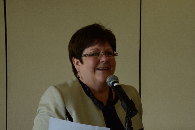 Dr. Anne M. Loochtan, new provost of the Northern Virginia Community College Medical Education Campus, helps present the Harriet H. Fatzinger Nursing Memorial Scholarship at the Fort Belvoir Officers’ Club