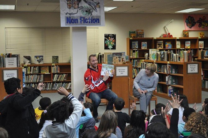 Washington Capitals forward Eric Fehr and co-author Pamela Duncan Edwards participate in a Q&A session with nearly 50 Key Elementary School students,